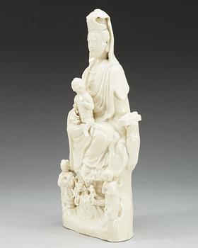 A blanc de chine figure of a seated Guanyin, Qing dynasty, 18th Century.