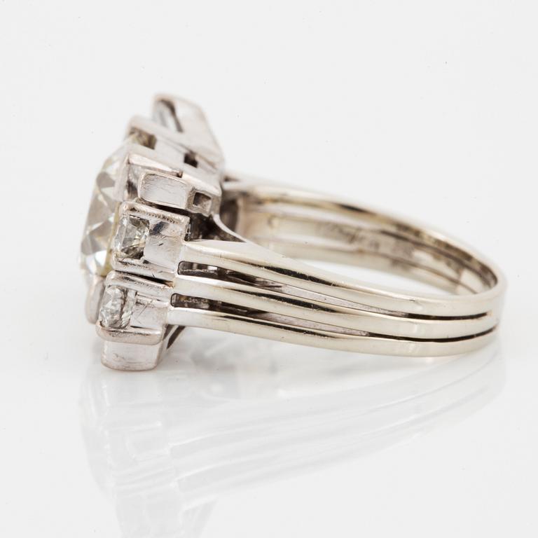 A baguette cut and old brilliant cut diamond ring.