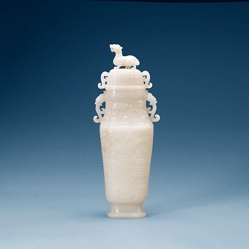 A archaistic carved white stone vase with cover.