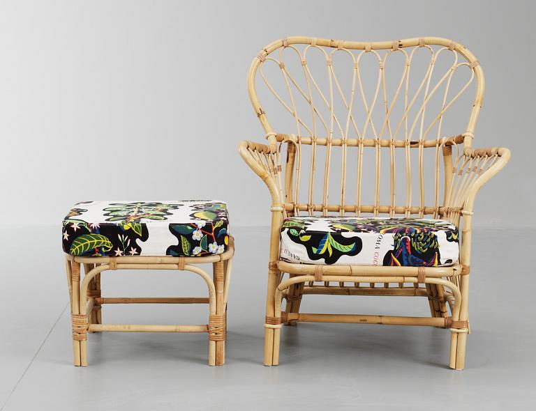 A Josef Frank ratten easy chair and stool, Svenskt Tenn, model 311.