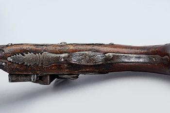 An 18th Century flinlock pistol.