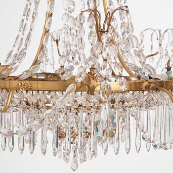 A German Louis XVI gilt-brass and cut-glass six-light chandelier, late 18th century.