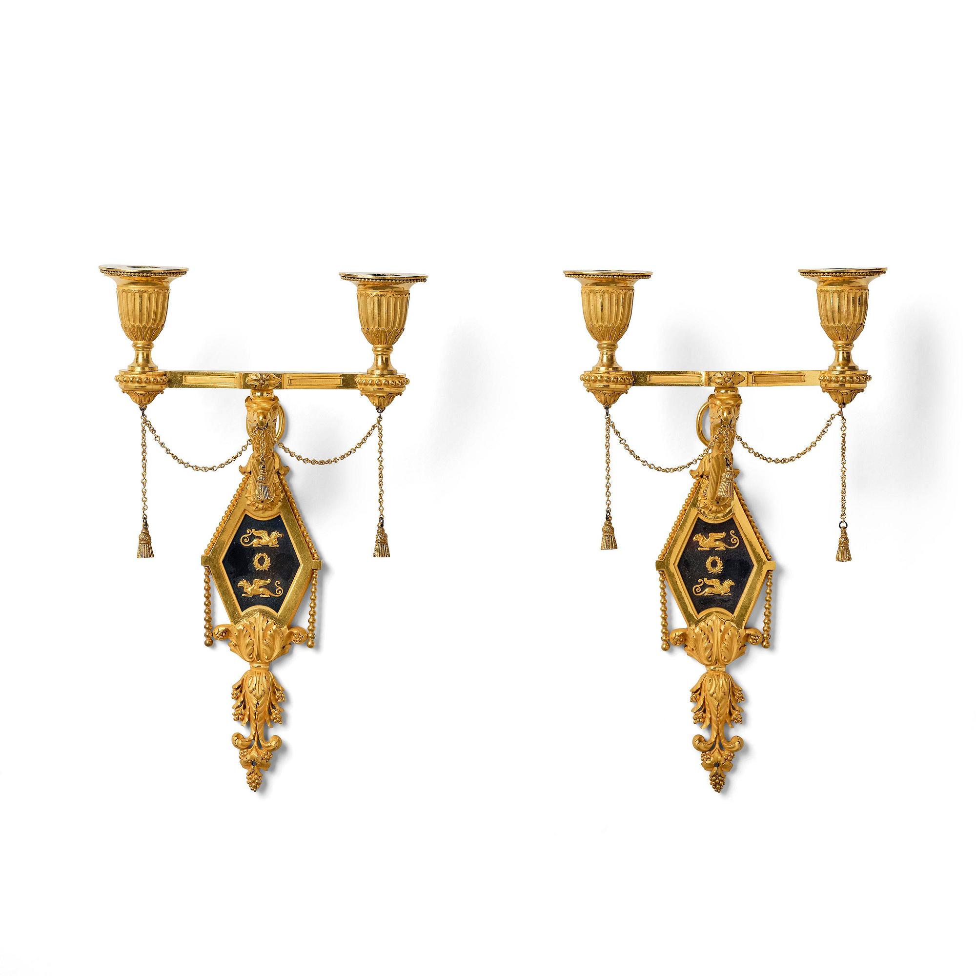 A pair of two-branch late Louis XVI ormolu and blued steel appliques attr. to F. Rémond (bronzier in Paris 1774-1812).