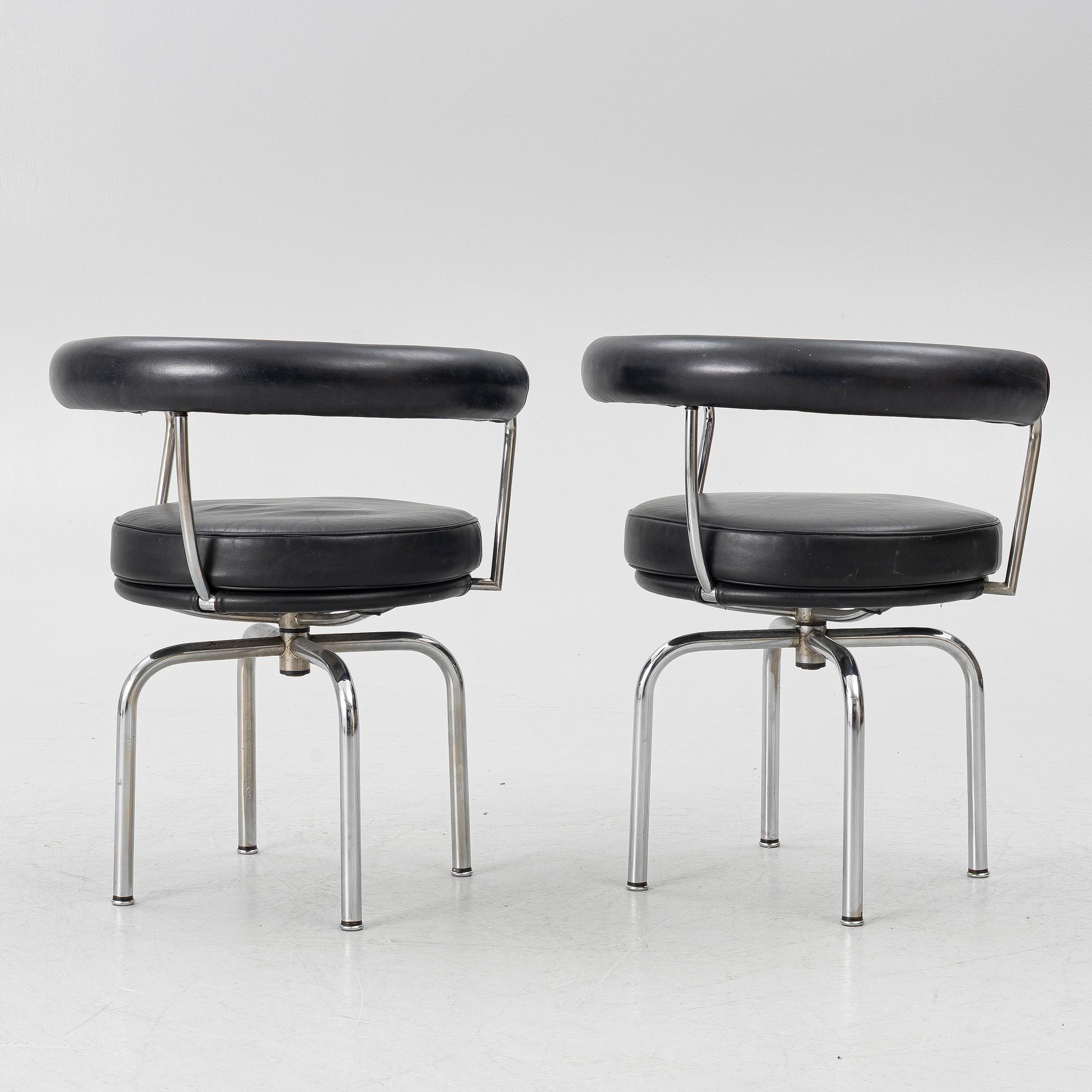 Charlotte Perriand, /Le Corbusier, swivel armchairs, a pair, model LC7, Cassina, Italy, later part of the 20th century.