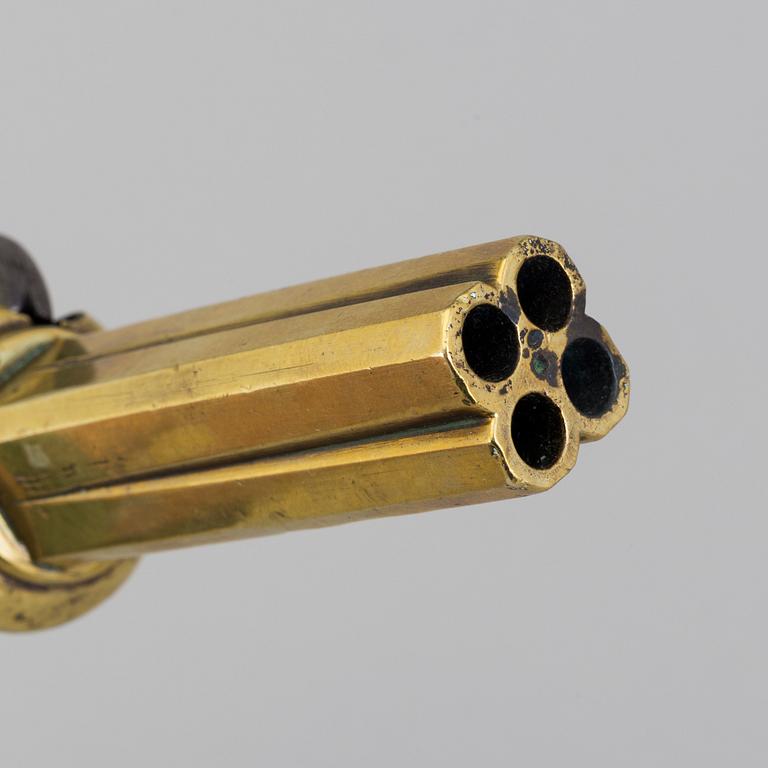 A second half of the 19th century four-barrel Swedish brass percussion revolver.