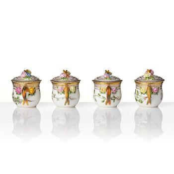 A set with four Royal Copenhagen 'Flora Danica' custard cups with covers and stands, Denmark, 20th century.
