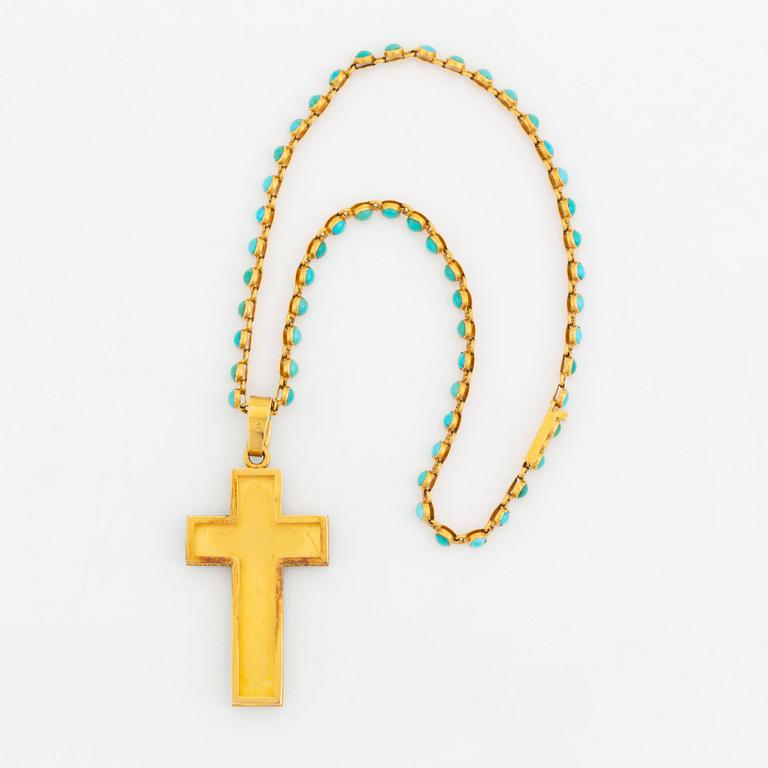 An 18K gold and turquoise cross with a chain and a 14K gold bracelet set with turquoises.