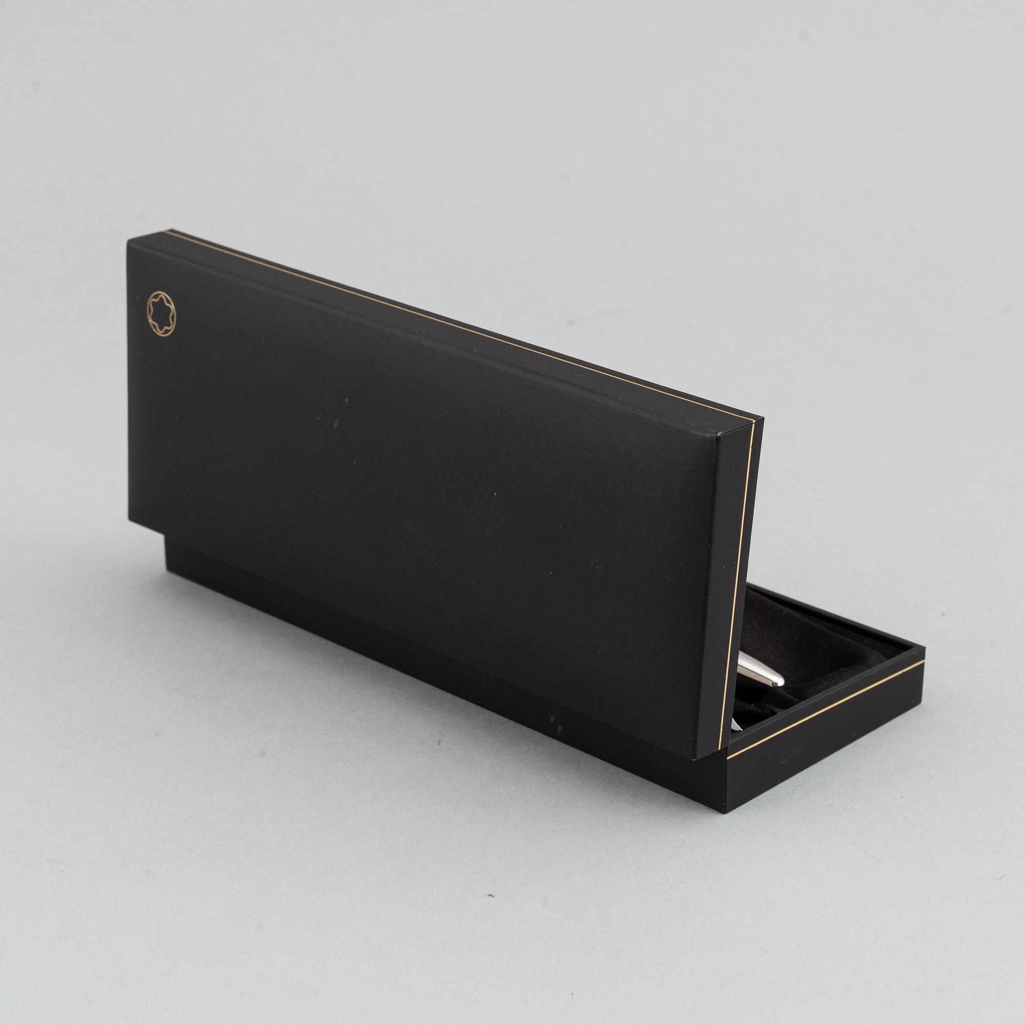 MOntblanc, a ball point pen and leather passport holder.