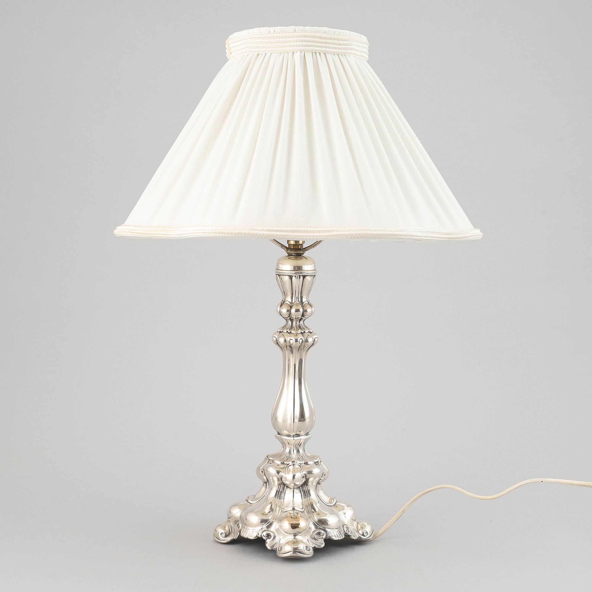A silver plate neo-rococo tablelamp by CG Hallberg.