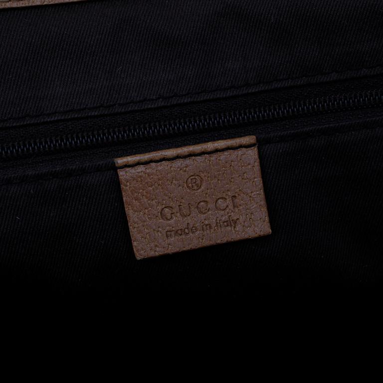 GUCCI, a pink monogram canvas handbag.