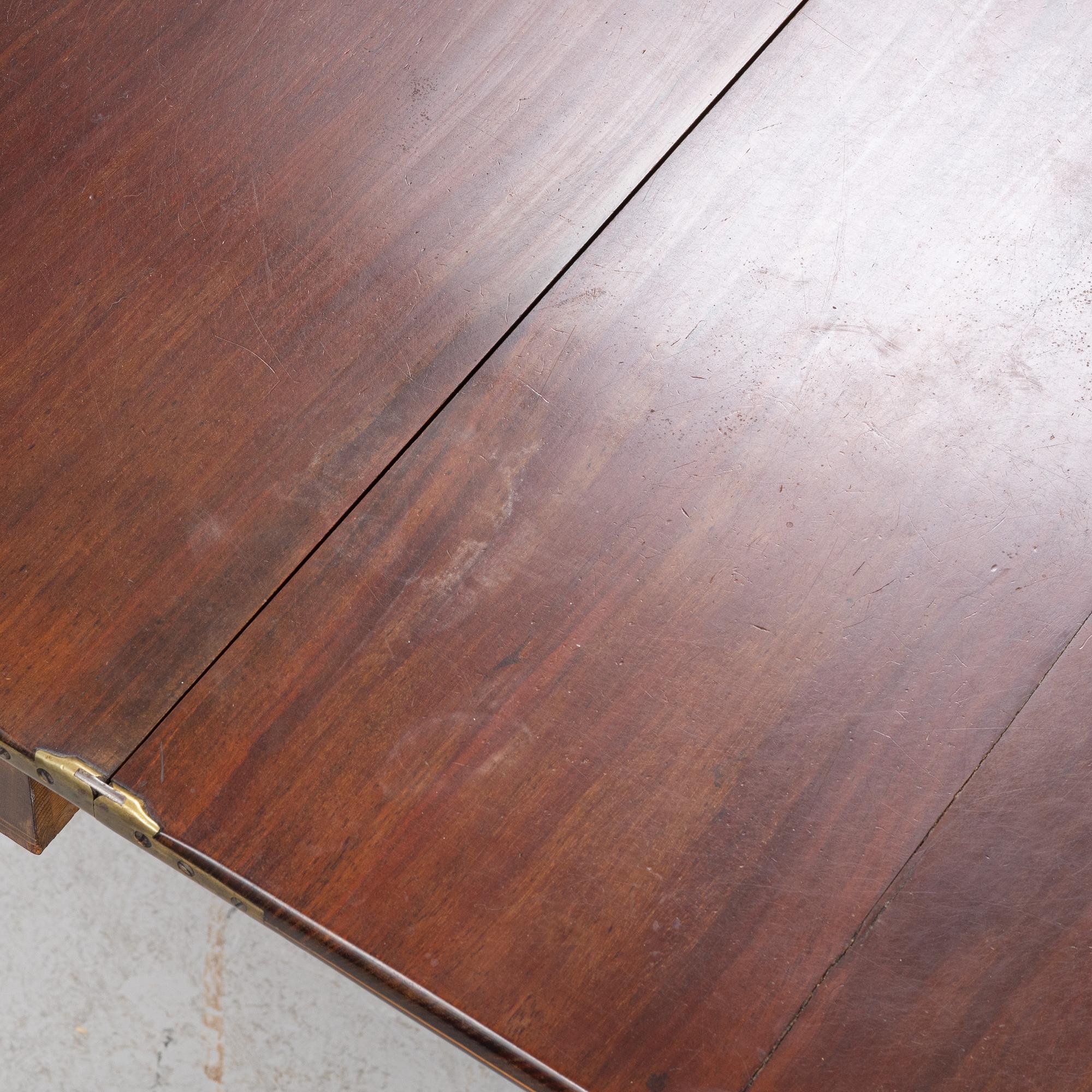 A mahogany games table, early 19th Century.