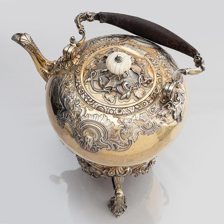 An English silver-gilt teapot with stand and burner, mark of Richard Sibley I, London 1825.