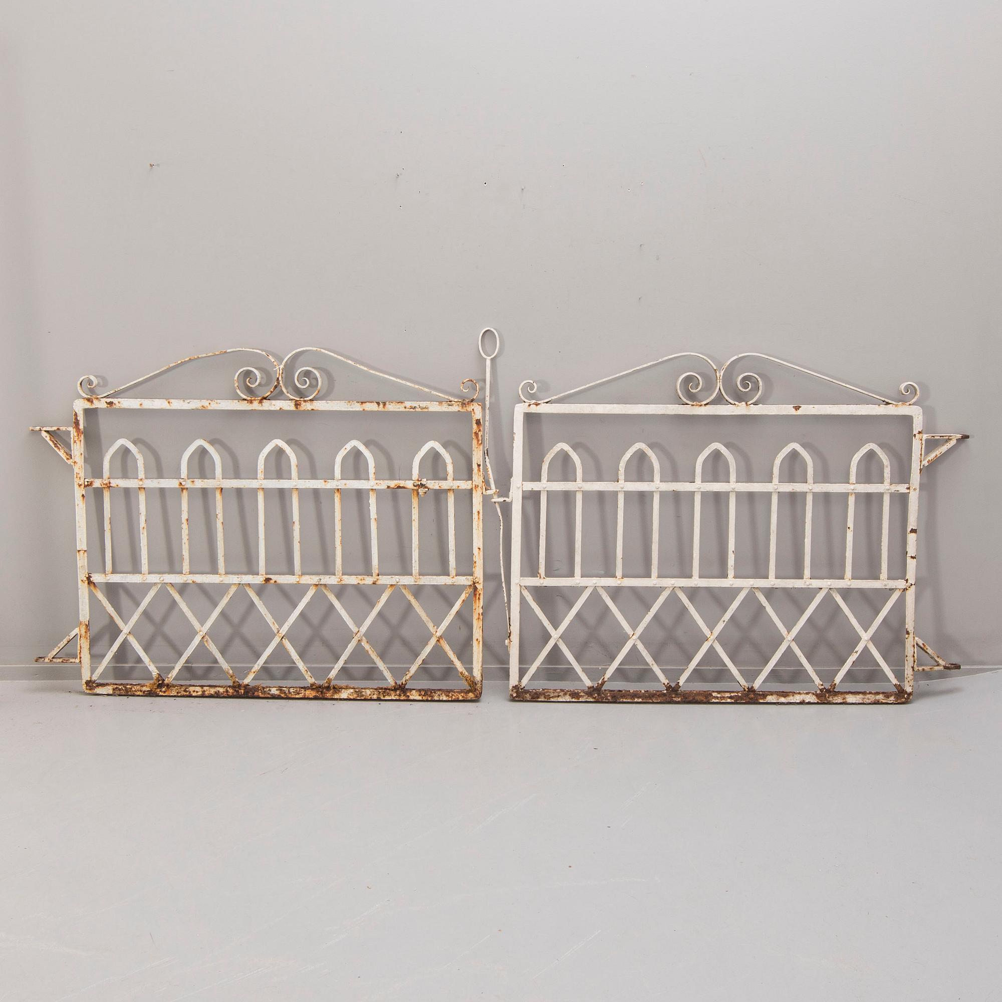 A pair of painted wrought iron gates around 1900.