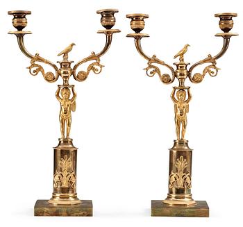 605. A pair of Swedish Empire gilt bronze two-light candelabra.