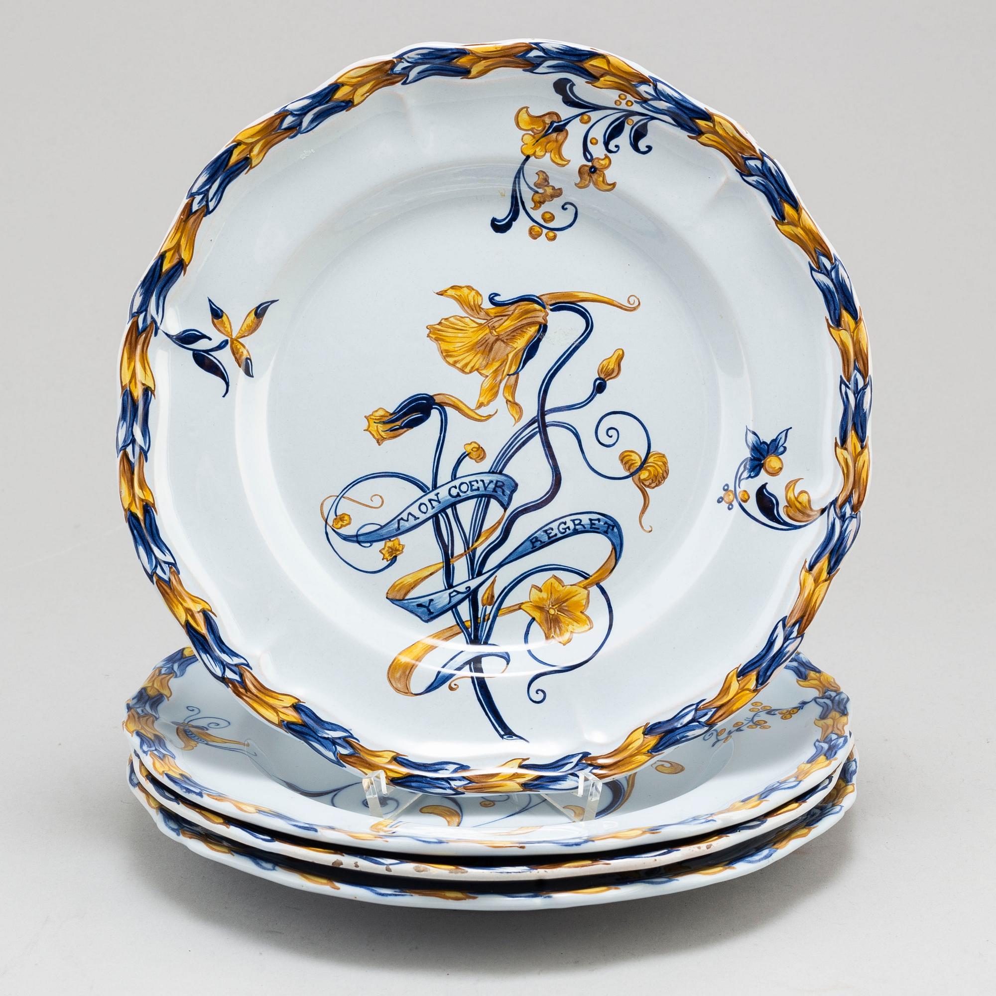 A set of four french faience cabinet plates signed Emile Gallé, Nancy. C. 1900.