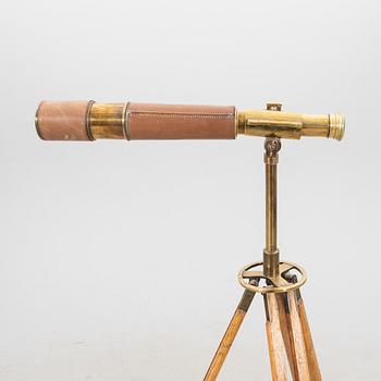 A brass and leahter tube binocular with stand around 1900.