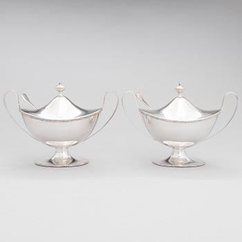 A pair of lidded silver sugar bowls with sprinkle spoons, mark of The Firm Carl Fredrik Carlman, Stockholm 1928-29.