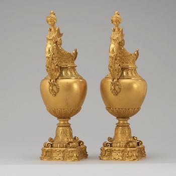 A pair of mid 19th century gilt bronze ornamental ewers.