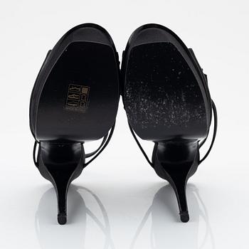 Yves Saint Laurent, a pair of black silk and bows platform sandals, size 37.