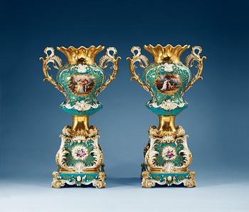 A pair of large french vases on stands, Jacob Petit, mid 19th Century.