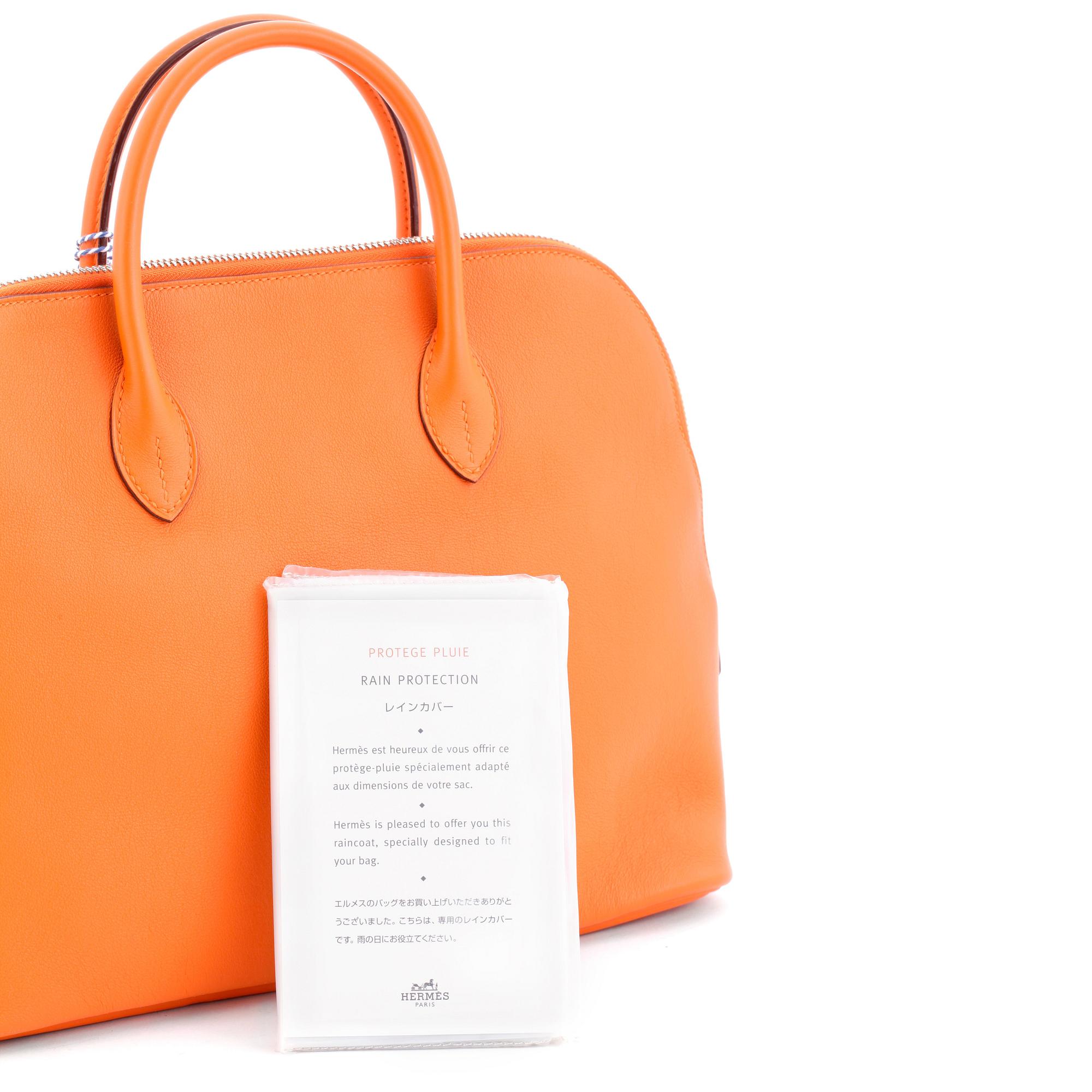 HERMÈS, a orange calf leather handbag, "Bolide".