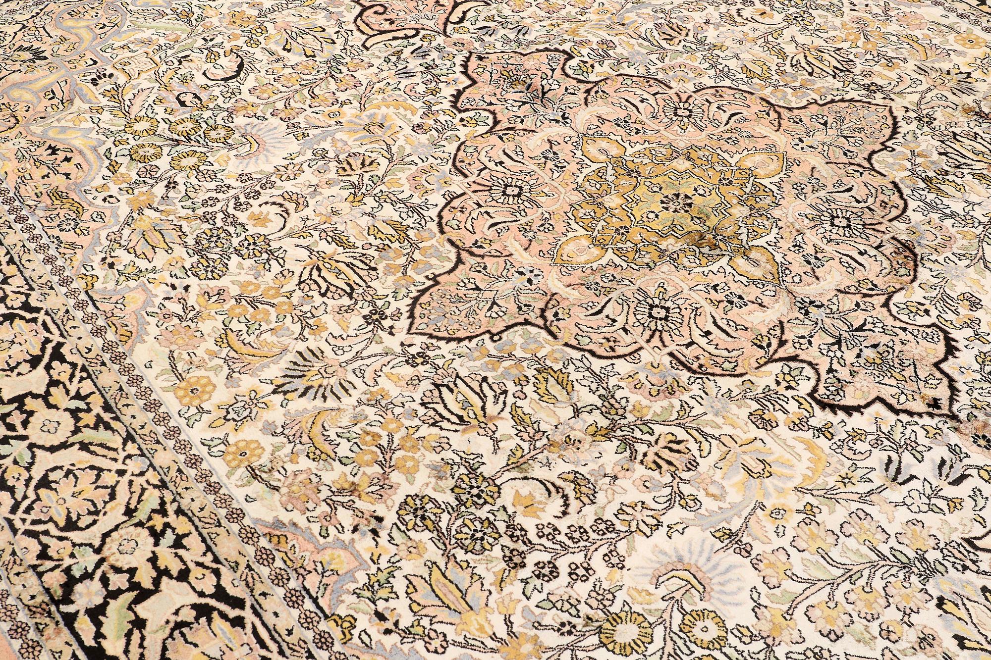 A CARPET, old silk Kashmir, ca 380 x 274 cm.