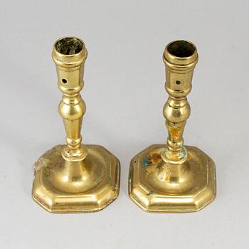 A pair of 18th century bronze candlesticks.