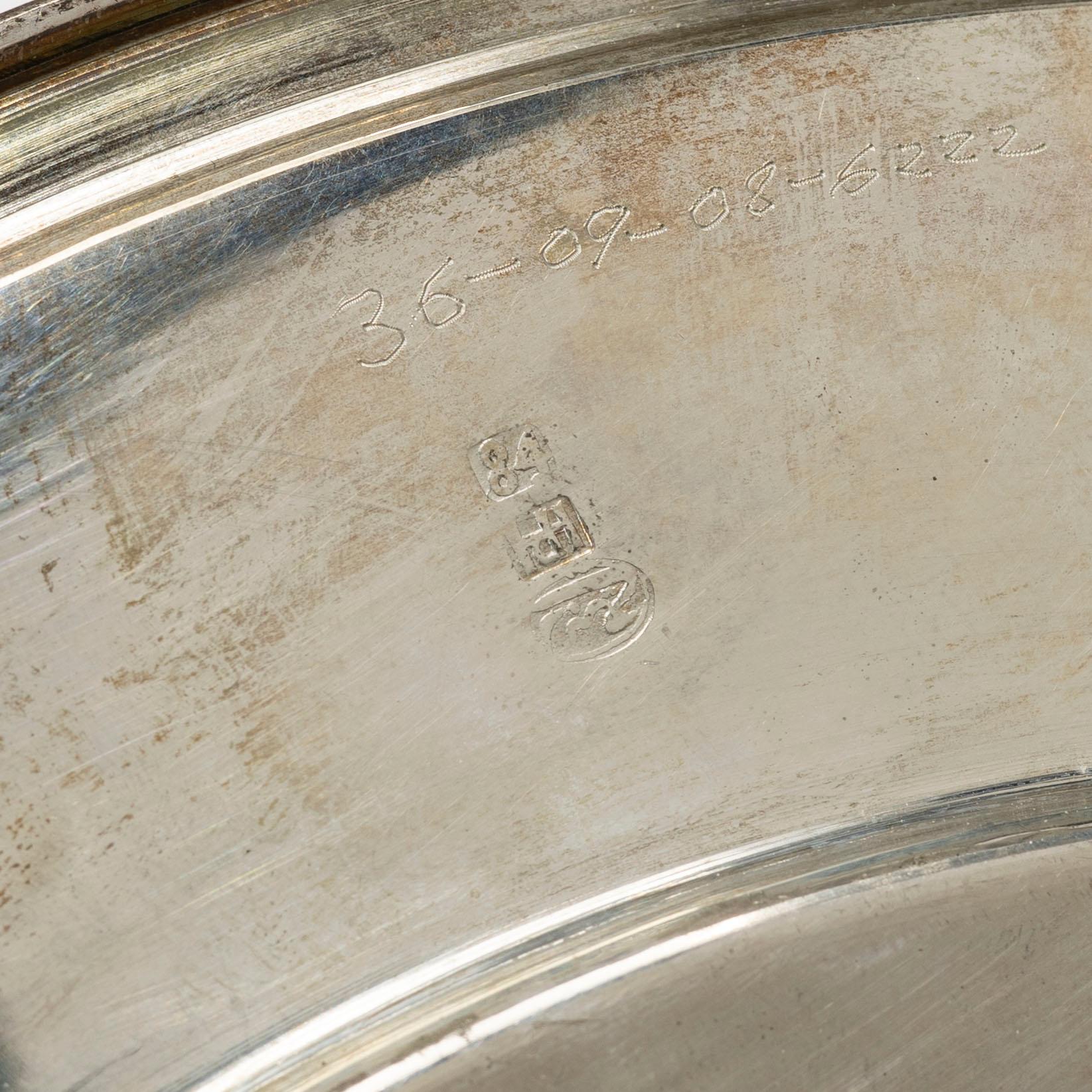 A pair of Persian silver plates, 20th century.