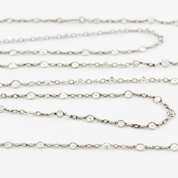 An antique platinum diamond long chain.