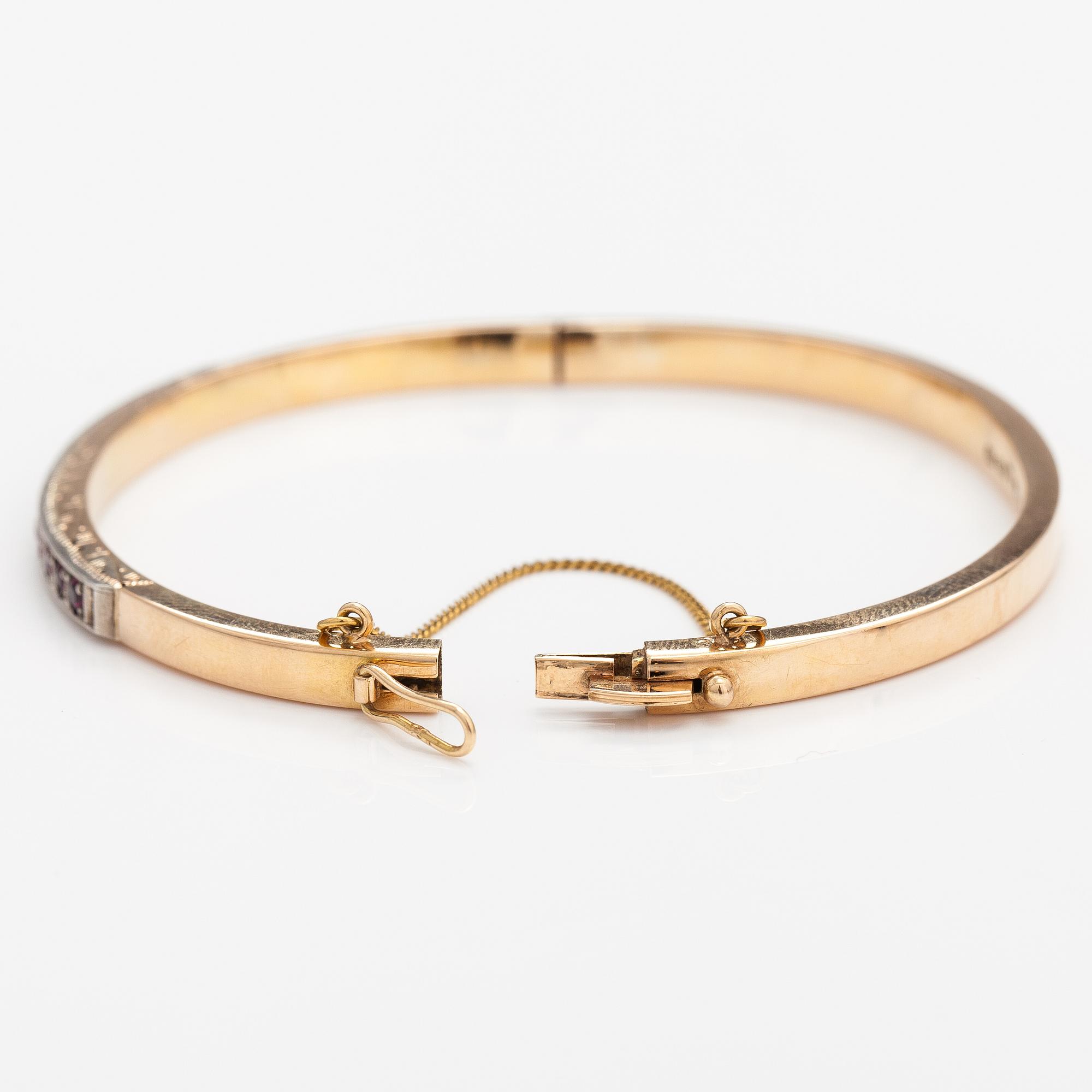 Armband, 14K guld, syntetiska rubiner. Tarkkanen Oy, Helsingfors 1959.