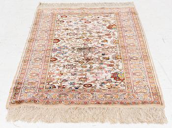 An Oriental silk rug, c. 122 x 76 cm.