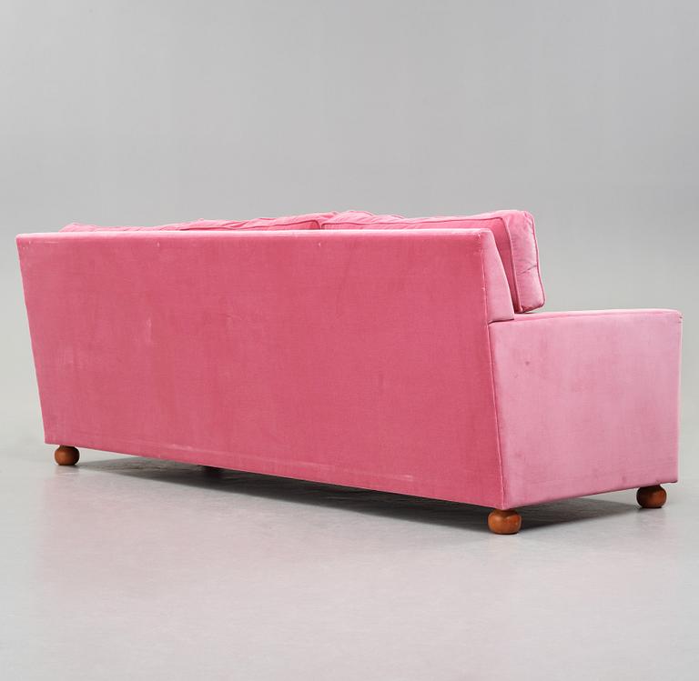 Josef Frank, a pink velvet upholstered three seated sofa, Svenskt Tenn, model 3031.