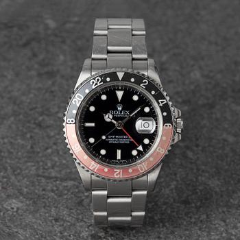 1119. Rolex, GMT-Master II, "Coke", ca 2001.
