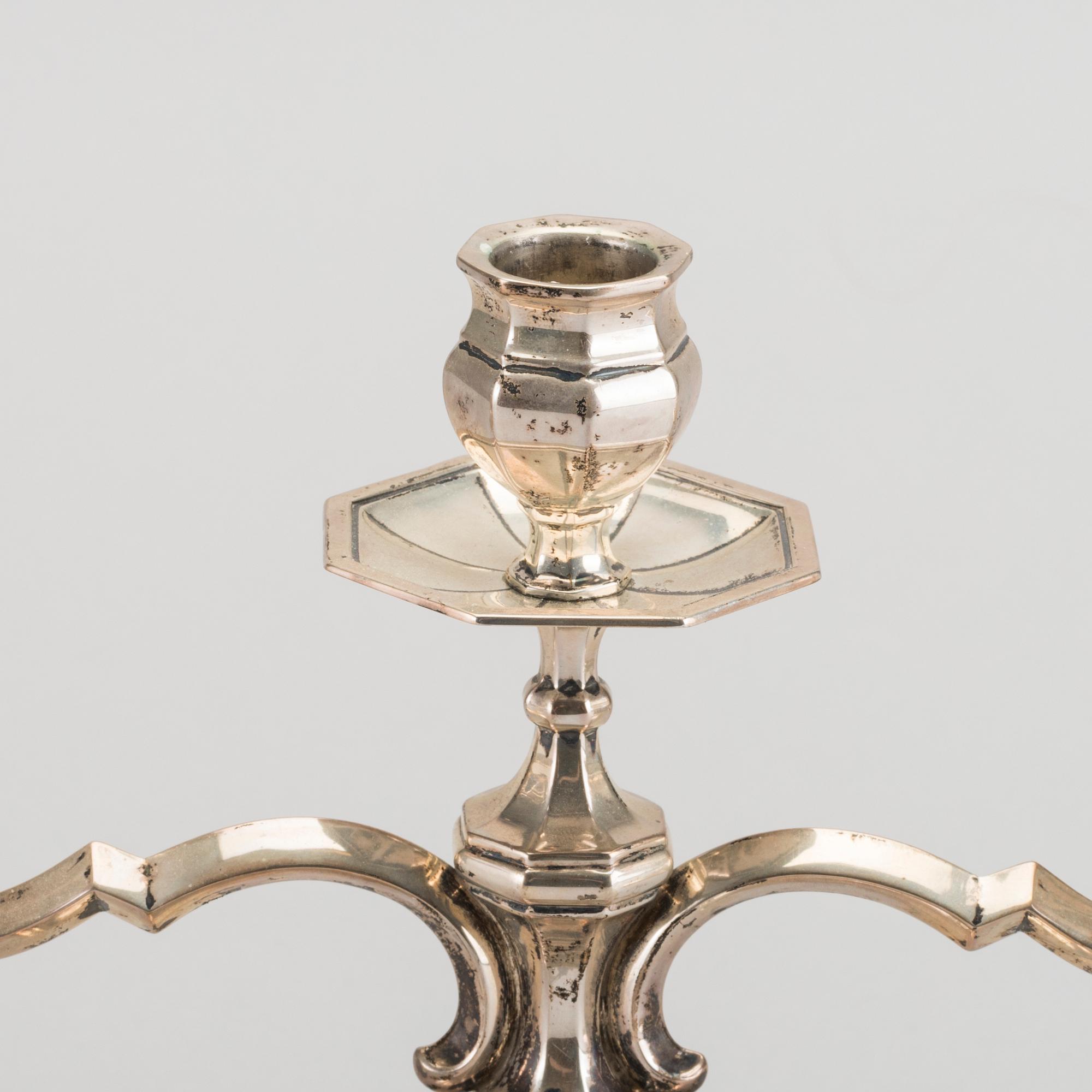 A pair of silver candelabras.