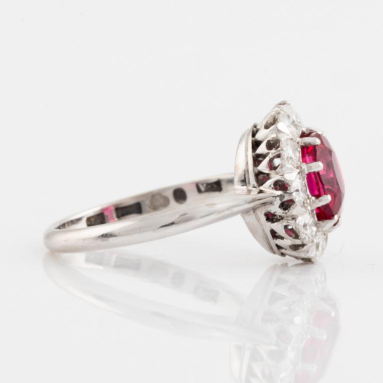 Pink spinel and brilliant cut diamond cluster ring.