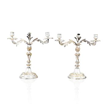 A pair of Swedish Rococo argent haché candelabra.