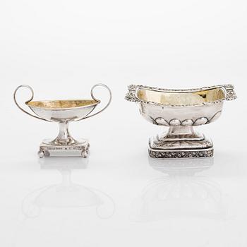 Two 19th-century silver salt cellars, St. Petersburg 1824 and Stockholm 1898.