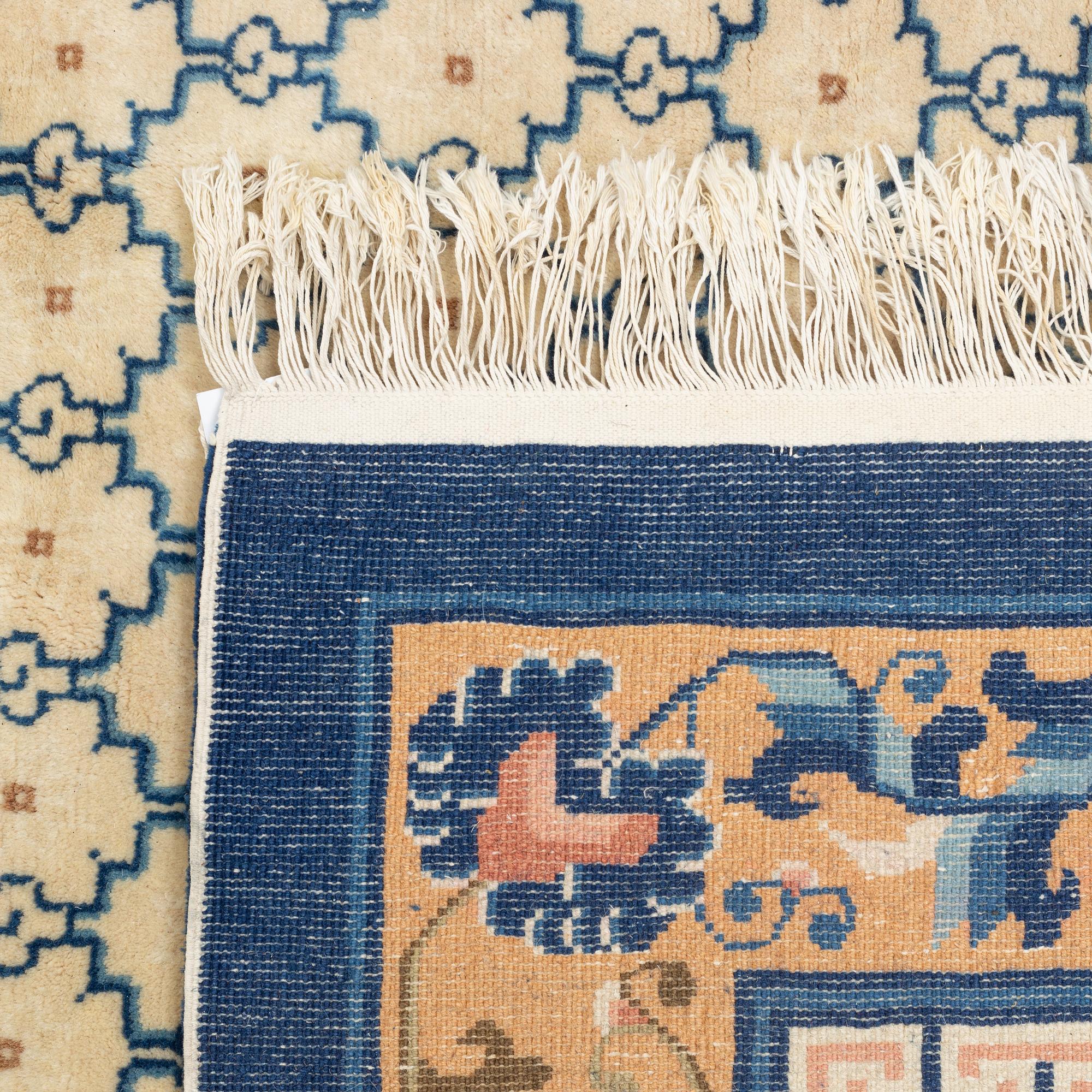 A carpet, China, antique finish, ca 275 x 185 cm.