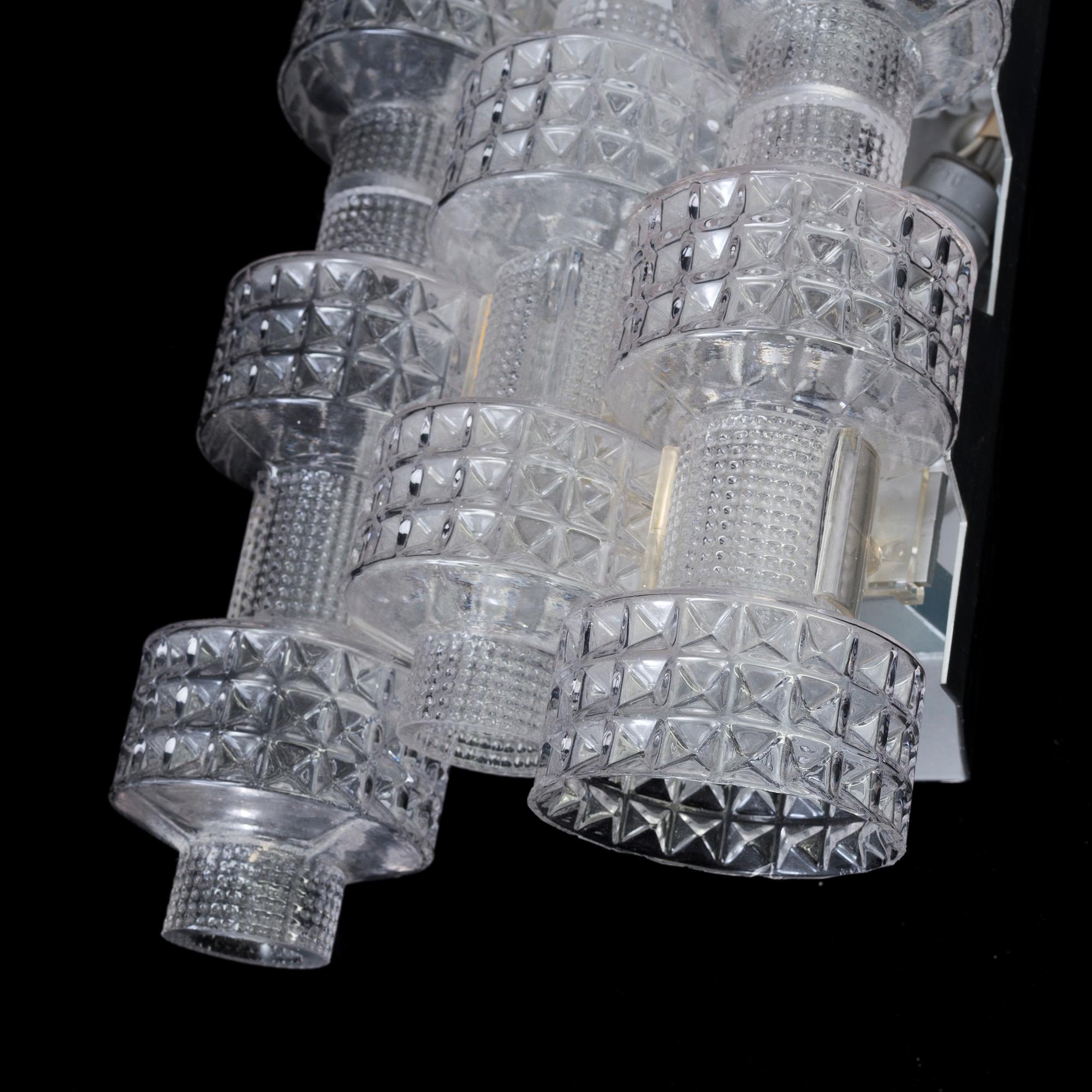 A pair of wall lamps by Gert Nyström for Fagerhult, second half of the 20th century.