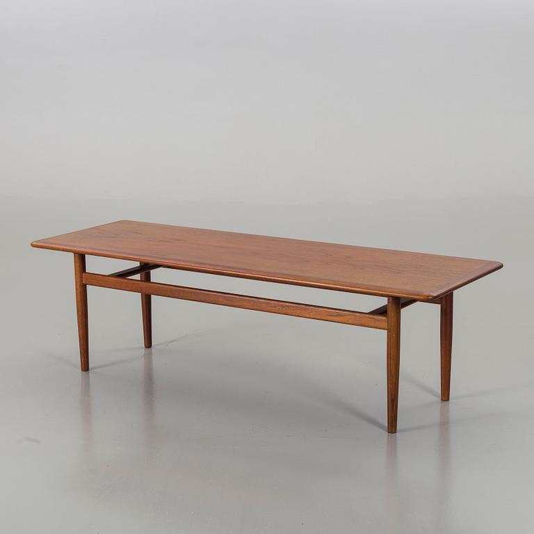 A Danish teak lounghe table.