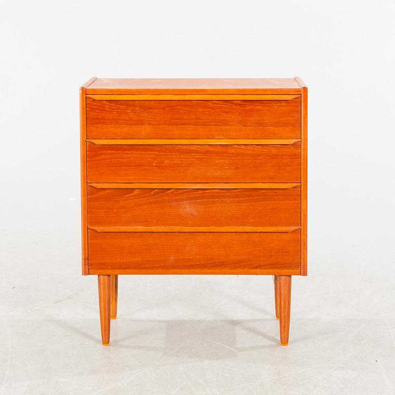 A mid 20th century teak veneered chest of four drawers.