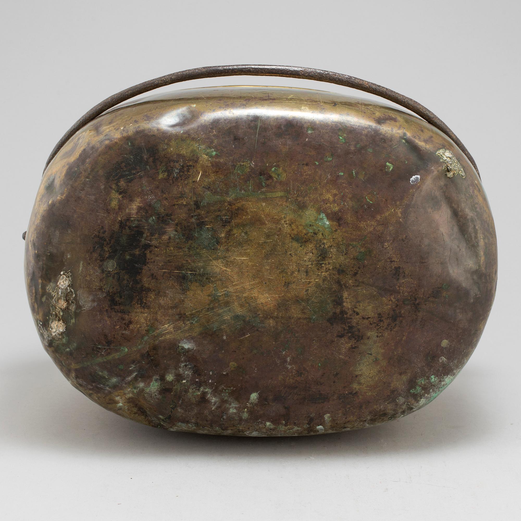 An 18th century brass cauldron.