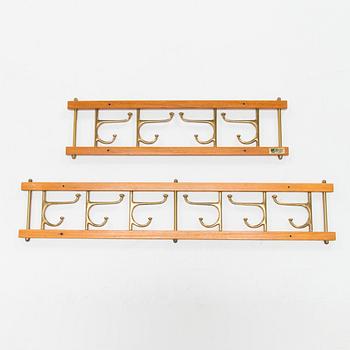 Two mid 20th century brass and teak coat hanger "Dekorativ" from Skoglunds metallgjuteri, Anderstorp.