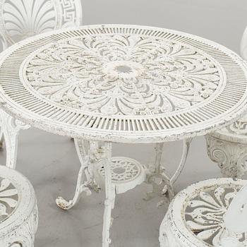 A SET OF FOUR GARDEN CHAIRS AND A GARDEN TABLE, second half of 20th century.