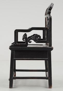 A black and red lacquered wooden chair, Qing dynasty.