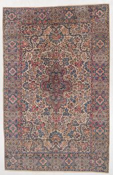 A semi-antique Kerman carpet, c. 273 x 172 cm.