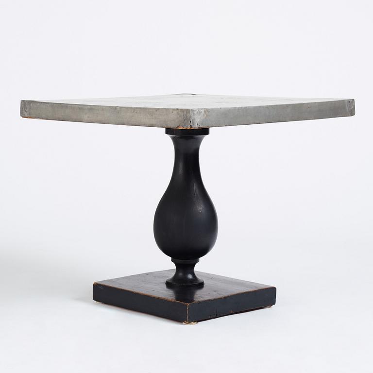 Uno Åhrén, a black lacquered table with a pewter top by Nils Fougstedt, Svenskt Tenn ca 1930. Alva & Gunnar Myrdal Collection.