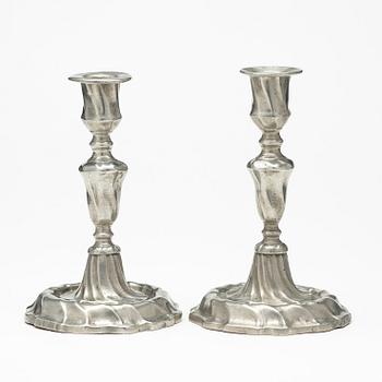 A pair of Swedish Rococo pewter candlesticks by L Lundwall 1762.