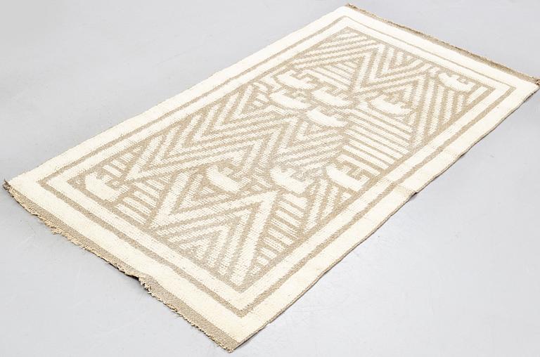 a carpet, knotted pile in relief, ca 187,5-189,5 x 96,5-100 cm, signed and dated S.K.L.H. 1945 at the back.