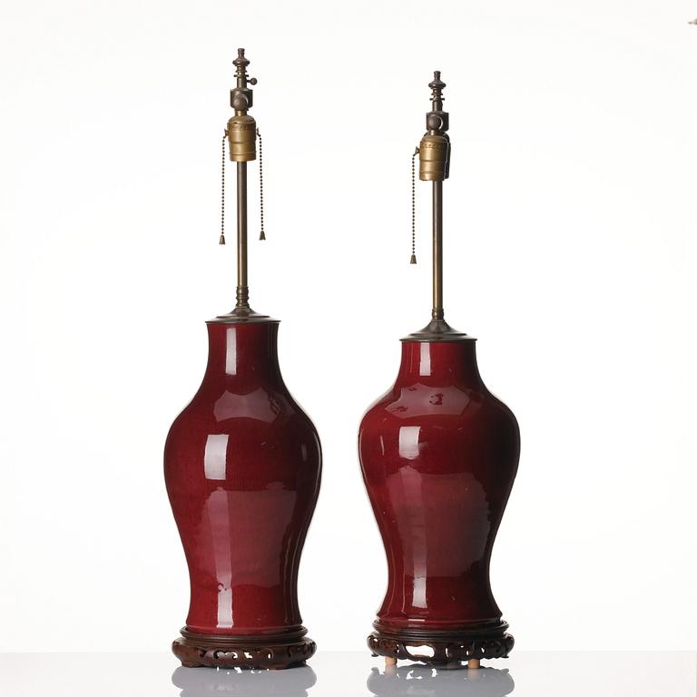 A set of two flambé glazed table lamps/vases, Qing dynasty, 19th century.